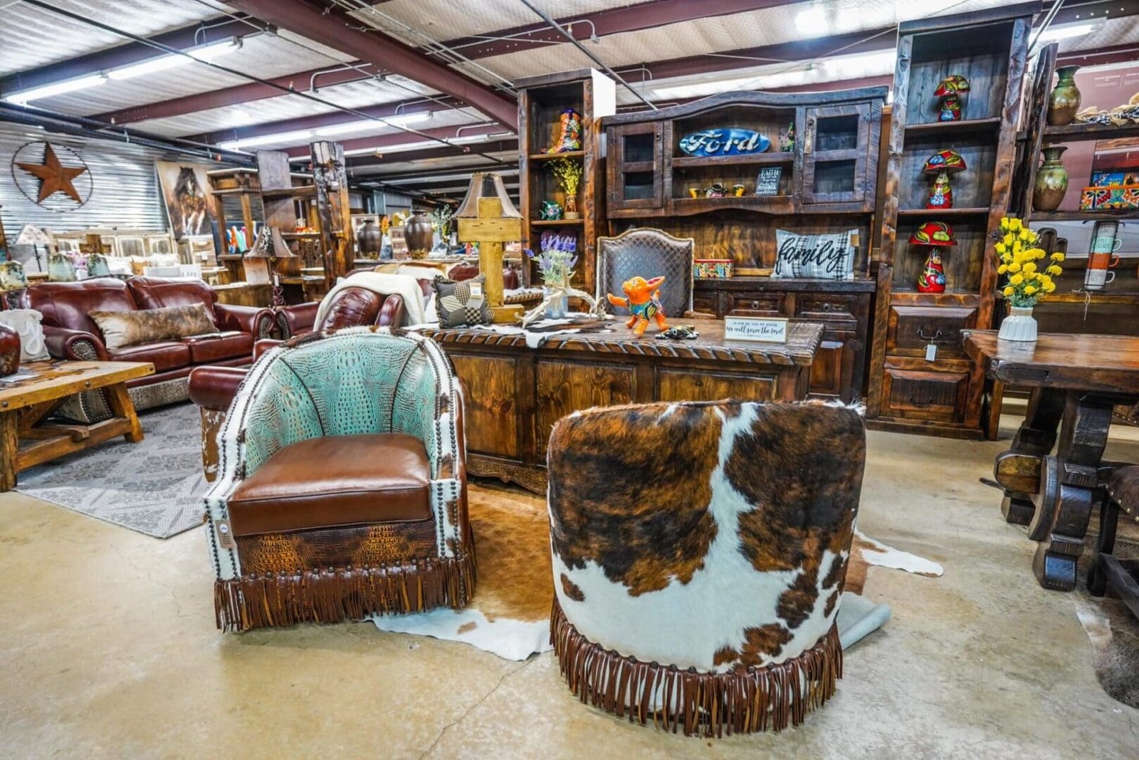 Coronel-desk-with-custom-leather-hide-chairs-scaled-1.jpeg